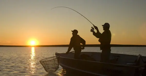 men fishing in a boat